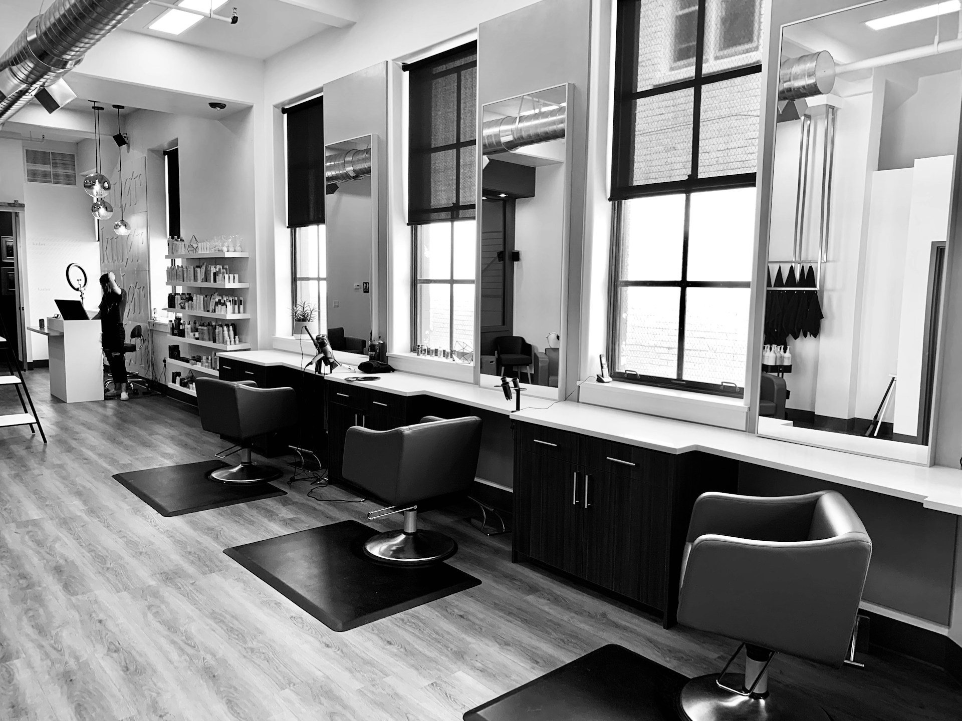 Luxury salon interior with professional styling chairs and warm lighting